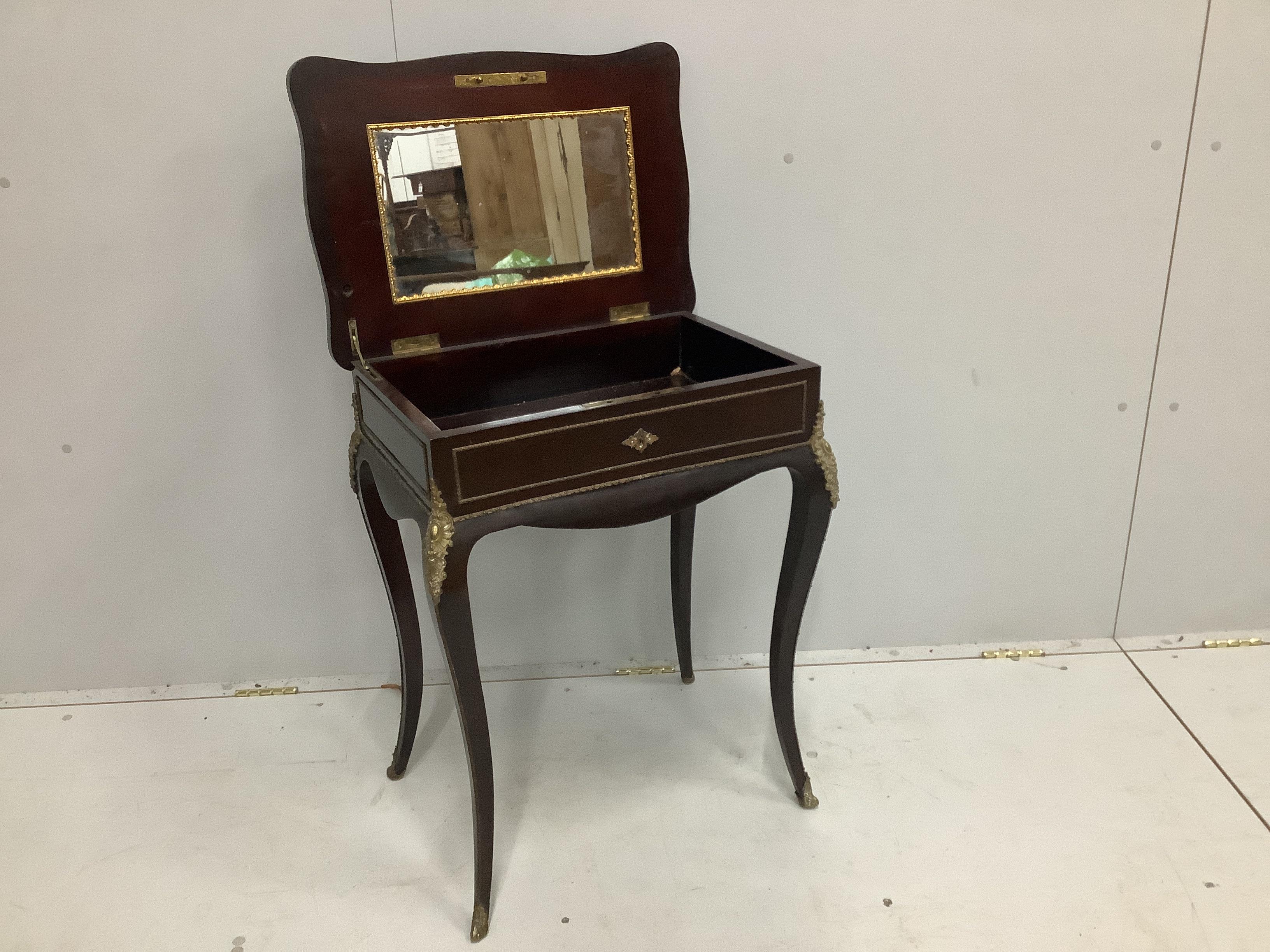 A 19th century French gilt metal mounted and brass inlaid enclosed dressing table, width 57cm, depth 41cm, height 72cm
